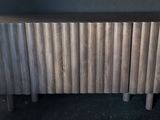 a radiator in the corner of a room next to a door