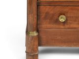 a small wooden chest of drawers with brass handles