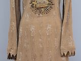a brown dress with fringes on a mannequin mannequin mannequin mannequin mannequin mannequin mannequin mannequin