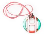 pink, green, and white necklace with a circular pendant on a pink cord