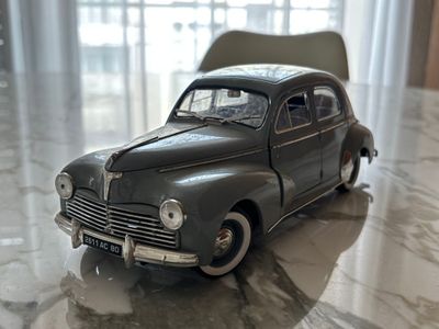 a toy car that is sitting on a marble floor