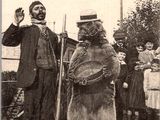 a man standing next to a bear with a cane