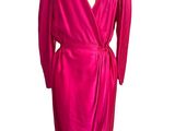 the dress is pink and has black trims on the shoulders