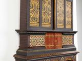 a wooden shelf with a clock on top of it