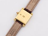 an image of a close up of a wrist watch on a white surface