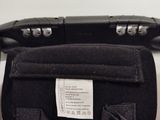 a black bag with a label on it sitting on a table