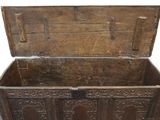 an old wooden chest with carvings on it