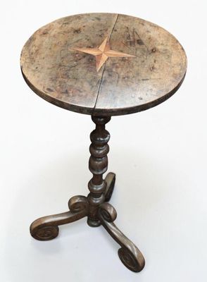 a small table with a star on top of it