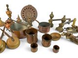 many different types of brass items on a white surface