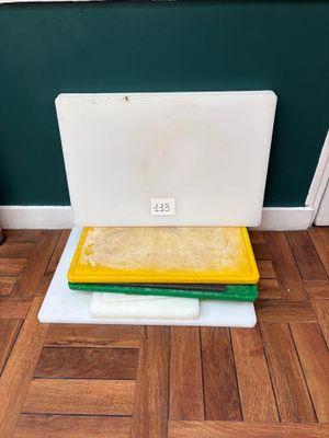 a laptop computer sitting on top of a pile of books