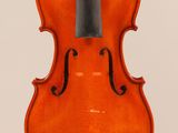 an orange violin with a black bow on a white background