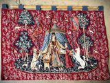an image of a tapestry hanging on the wall of a room