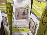 a stack of boxes with a picture of a woman in a bathtub