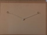 a picture of a picture of a necklace hanging on a wall