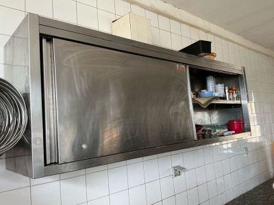 a large stainless steel oven in the middle of a kitchen