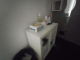 a blurry photo of a cat sitting on a cabinet