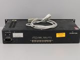 a close up of a black box with a white cord on it