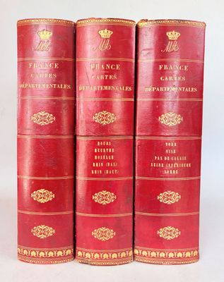 three red books with gold trims are stacked on top of each other