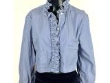 the shirt is blue and white striped with a ruffled collar