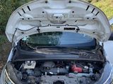 the engine of a car with its hood open and the hood up