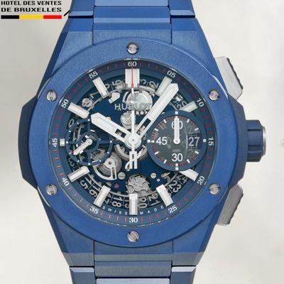 the watch is blue and has a black dial on the face