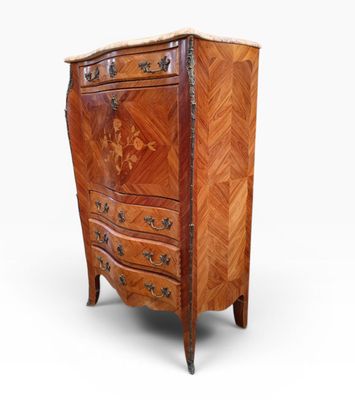 an antique wooden chest of drawers with a marble top