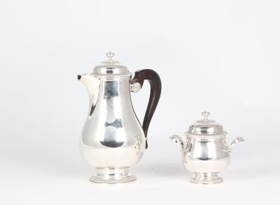 silver plated coffee pot and sugar shaker on stand