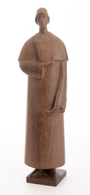 wooden statue of a man with a hat and coat on a white background