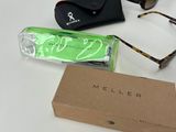 a box of sunglasses and a pair of sunglasses on a table