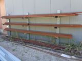 a long row of empty benches on the side of a building