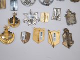 many different types of military badges on a white surface