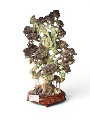 an image of a sculpture of a tree on a wooden base
