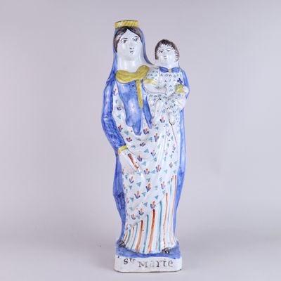 an image of a statue of a woman holding a child