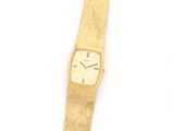 an image of a gold wrist watch on a white background