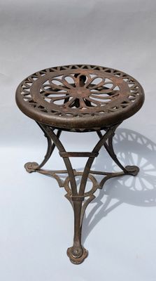an image of a small table with a flower design on it