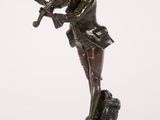 a bronze statue of a woman holding a bird on a wooden base