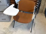 a stack of chairs and a table in a room full of filing cabinets