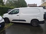 a white van that is parked on the side of the road