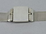 an image of a silver metal bracelet with a square clasp