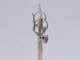 sterling silver and amethorate earrings on a gold plated stand