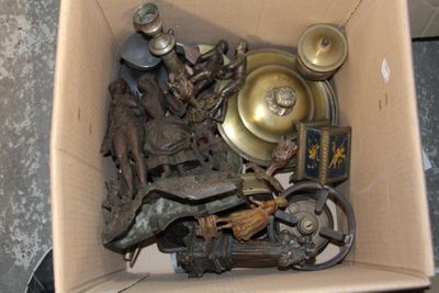 a cardboard box filled with assorted metal items
