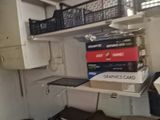a room with a bunch of boxes on the shelves