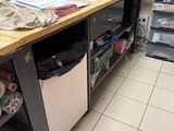 an image of a workbench with a lot of papers on it
