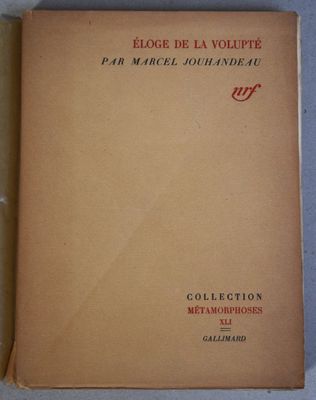 the book is open on a white surface with a yellow cover
