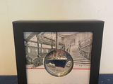 framed picture of a picture of a cat sitting on top of a table