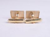 pair of gold tone cufflinks with a bar design on each side