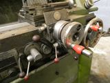an image of a machine that is working on a piece of metal