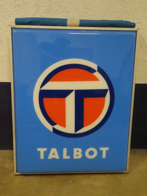 a sign that says talbot on the side of a wall