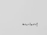 an image of a black and white photo of a person writing on a white wall