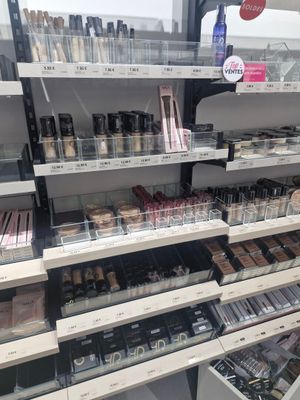 a lot of makeup products on the shelves in the store